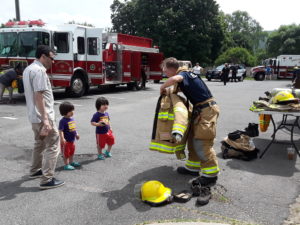 Kids got to try on real fire fighter equipment during our 2018 Touch a Truck.